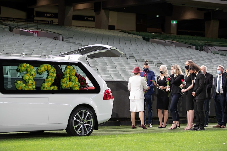 A hearse, featuring a floral arrangement with the numbers 324, at the MCG at Dean Jones's memorial service.