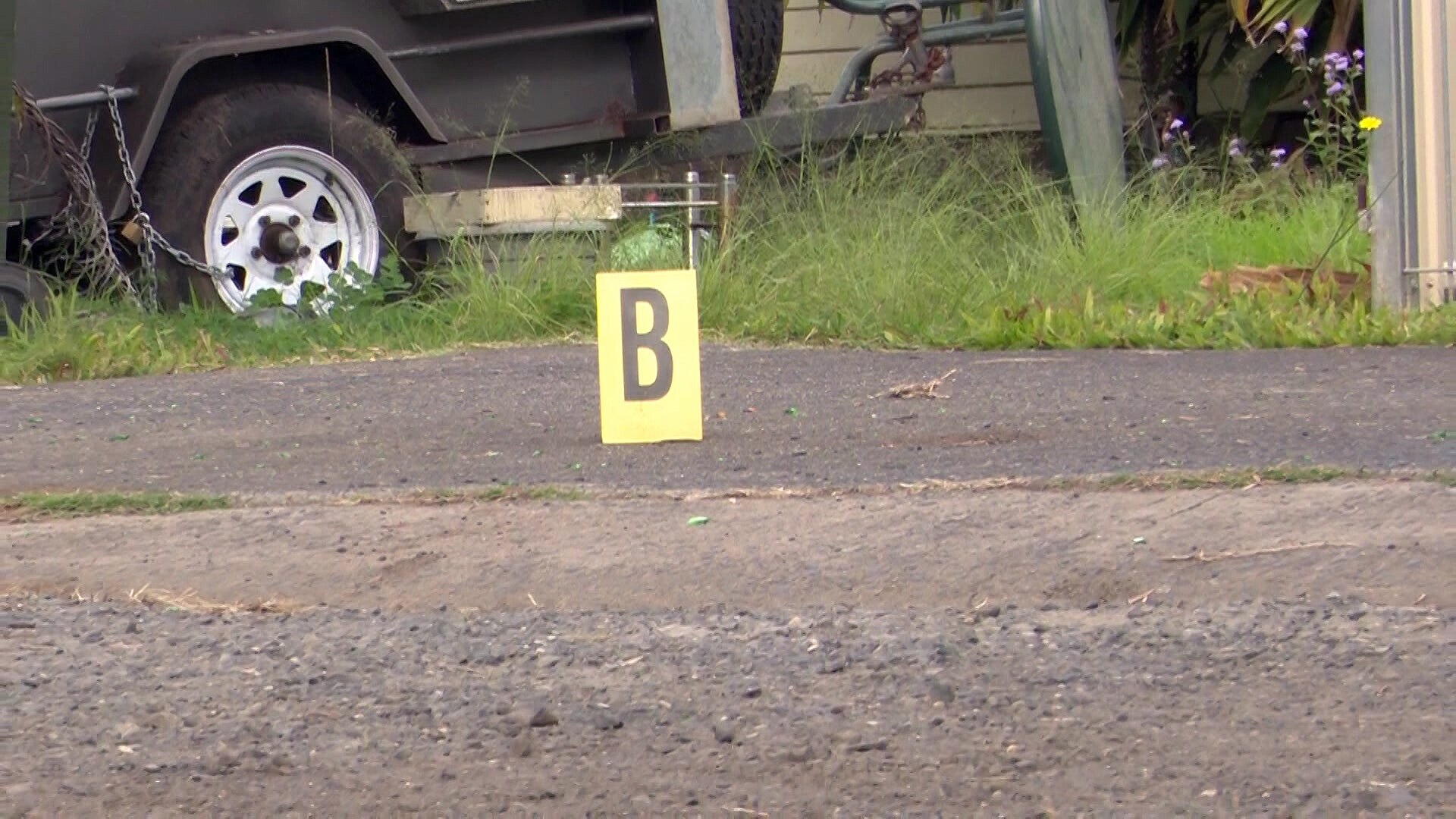 a yello sign with the letter B on the floor at a crime scene in casino in northern nsw where a woman allegedly murdered