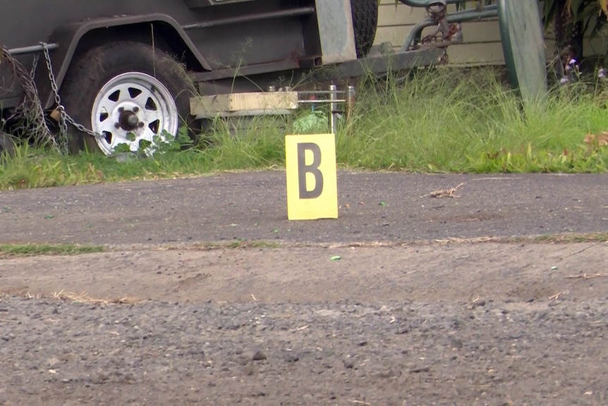 a yello sign with the letter B on the floor at a crime scene in casino in northern nsw where a woman allegedly murdered