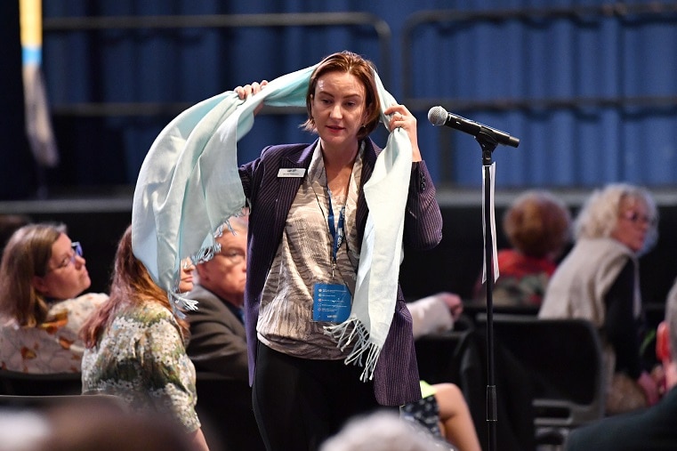 Ms Patterson with a scarf around her head at the LNP state convention.