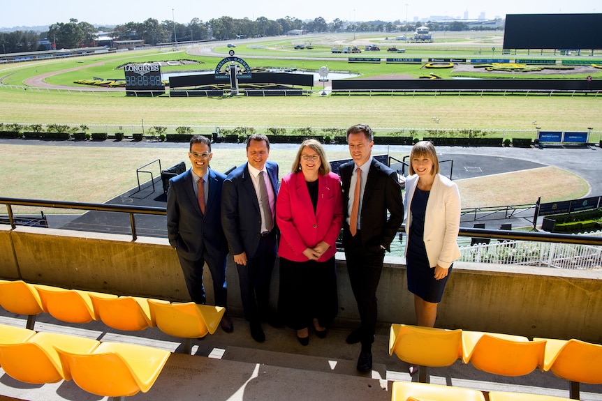 Ministers standing in front of Rosehill Racecourse 