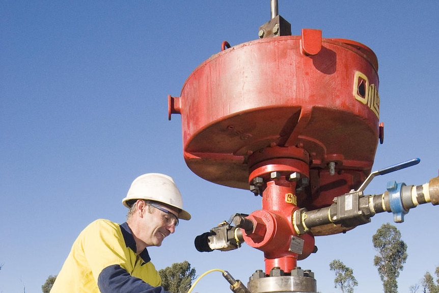 A miner works on a coal seam gas bore hole near Narrabri