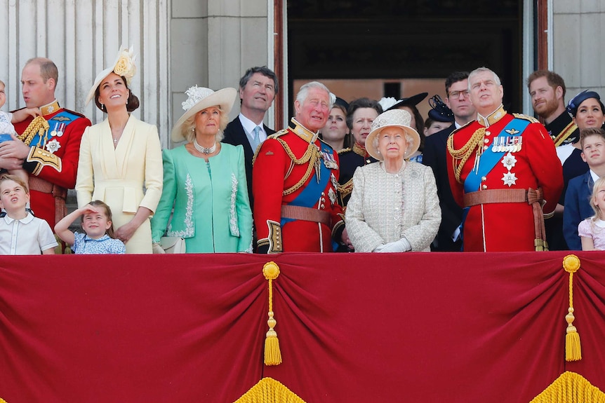the royal family on a balcony.