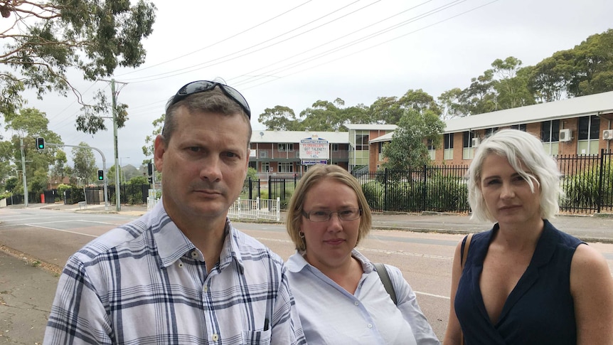 Parents Mark Freeman, Erin Griffiths and Robyn Adamson outside Floraville Public School.