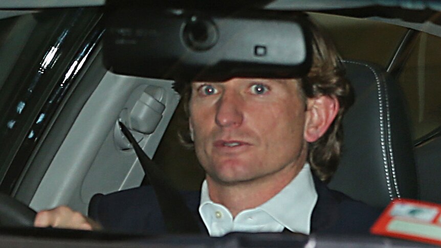 Essendon coach James Hird leaves after attending an AFL Commission hearing in Melbourne.
