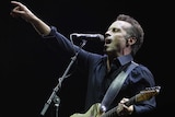 Mark Seymour performs with Hunters and Collectors