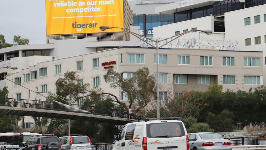 Electronic billboard overlooking Mitchell Freeway