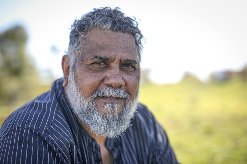 Close-up of Michael Woodley, a middle-aged man with a long greying beard.