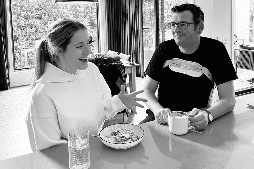 Daniel Andrews, pictured at home with his daughter