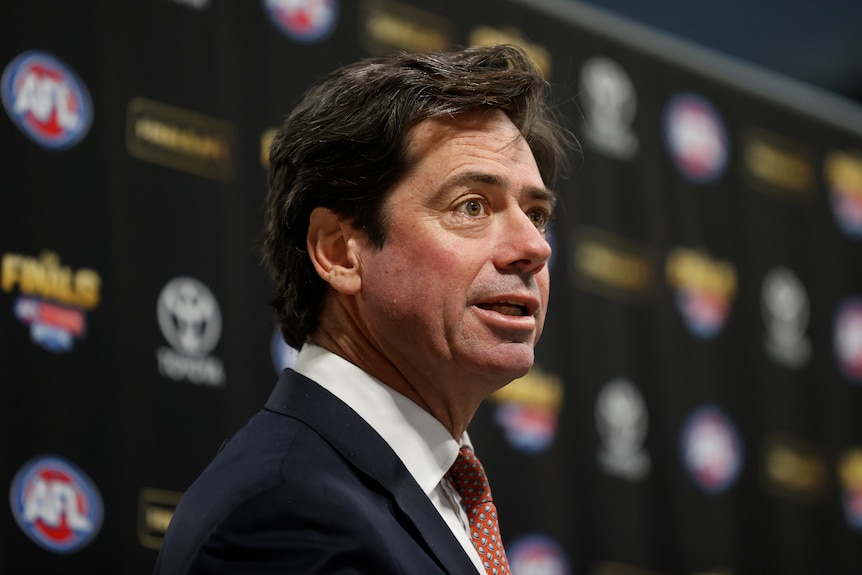 Gillon McLachlan speaks at a press conference