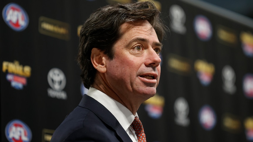 Gillon McLachlan speaks at a press conference