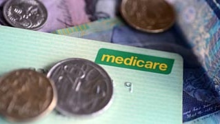 Medicare card and Australian money, notes and coins