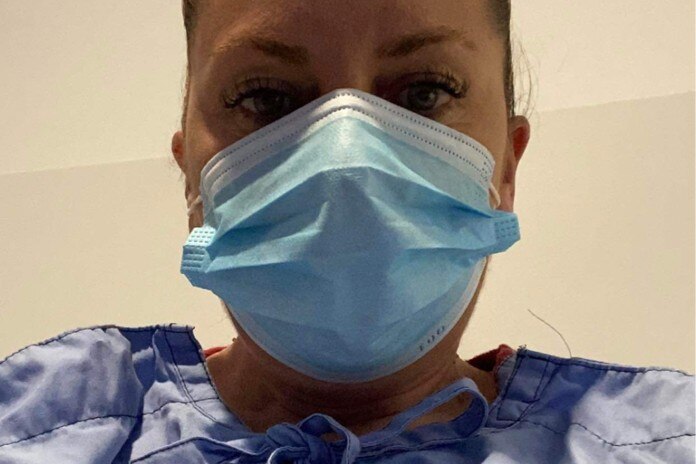 Woman wearing mask in hospital 