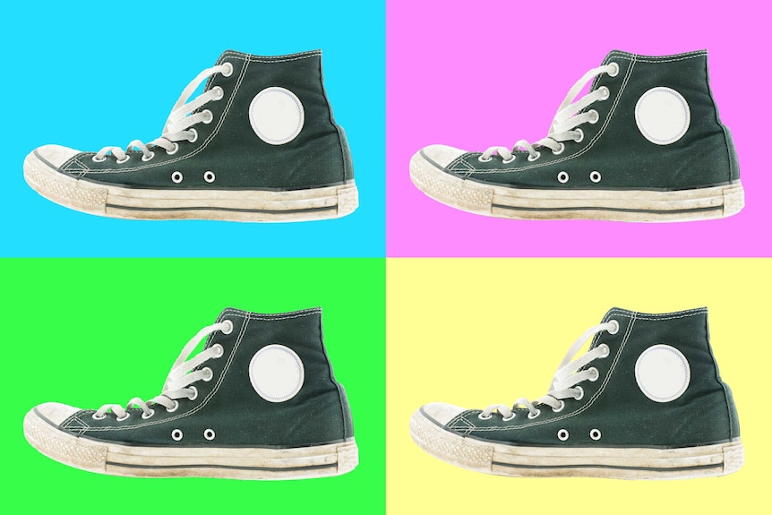 Four identical images of a black and white, high top sneaker.