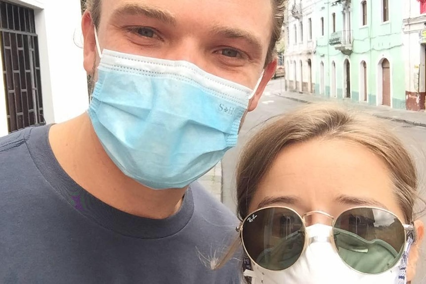 Ben Evans and Bridget Lindsay stand next to each other wearing face masks