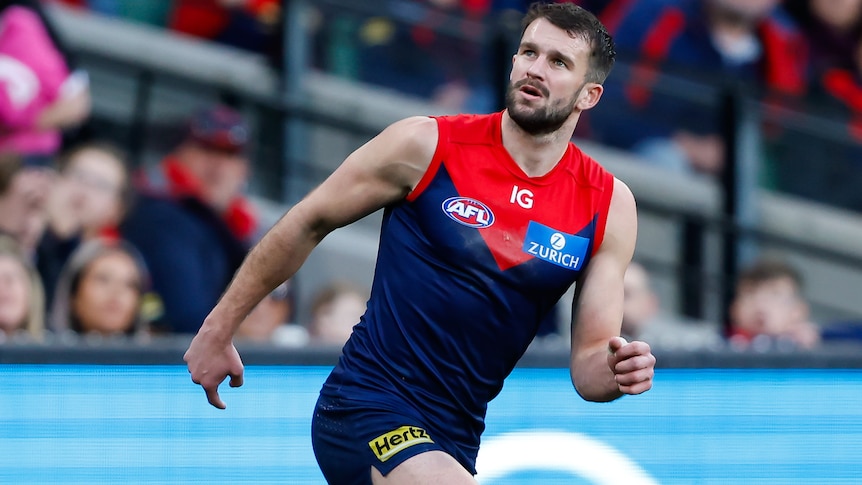 Joel Smith watches a kick during a 2023 AFL match.
