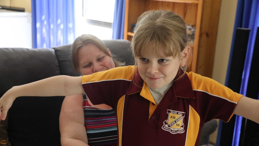 Scarlett Attree trying on a school uniform