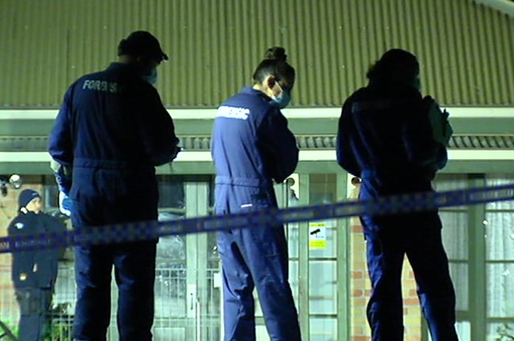 Three forensic officers arrive at the crime scene.