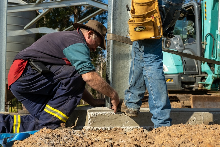 Warren Salway is working to rebuild the major infrastructure on his farm that were destroyed by bushfires.