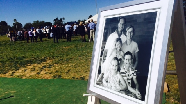 Portrait of Hunt family at memorial at Lockhart