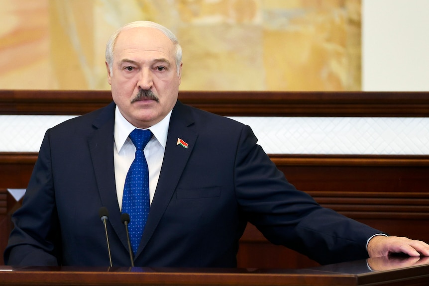 Belarusian President Alexander Lukashenko stands in parliament