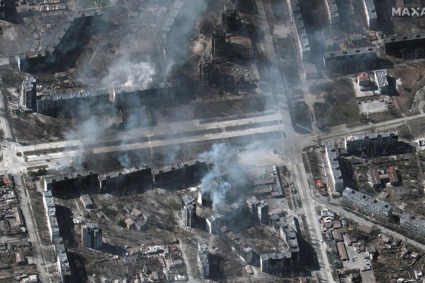A satellite image shows buildings on fire, in Mariupol.