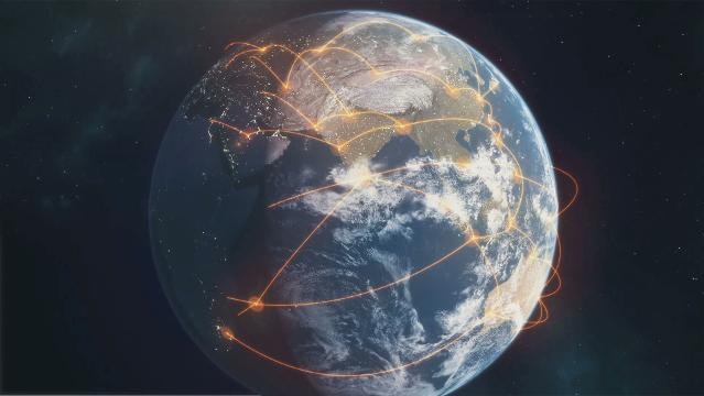 Planet Earth with lines showing air travel routes around the world