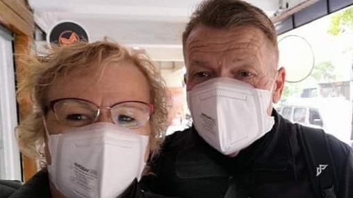 Coralie and Paul Williamson wear face masks.
