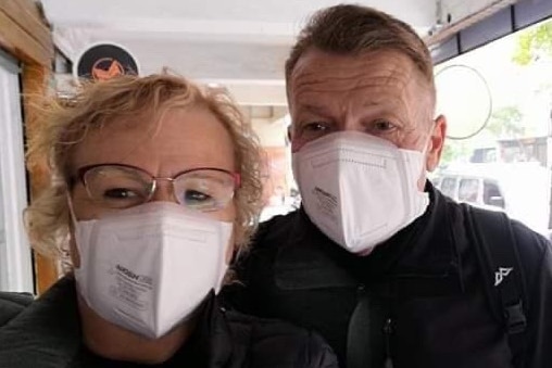 Coralie and Paul Williamson wear face masks.