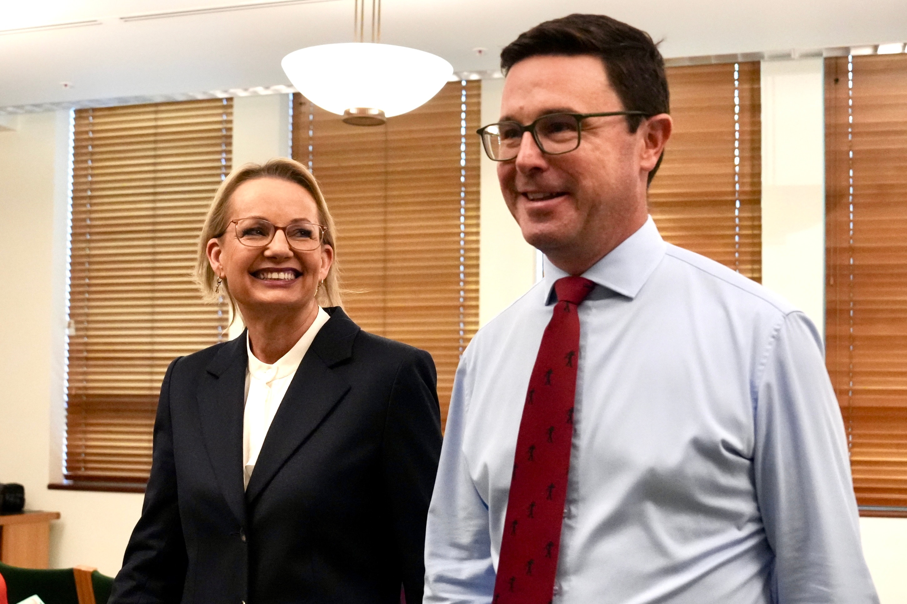 Sussan Ley smiling and looking at David Littleproud.