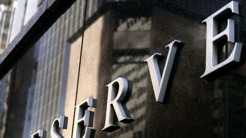 Part of the Reserve Bank of Australia sign sits on the side of the bank in central Sydney