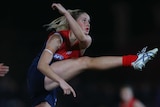 Tayla Harris kicks a goal for the Demons