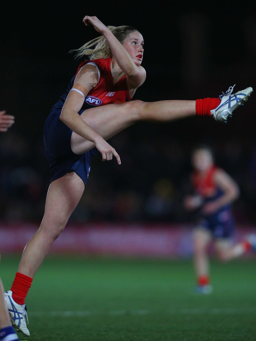 Tayla Harris kicks a goal for the Demons