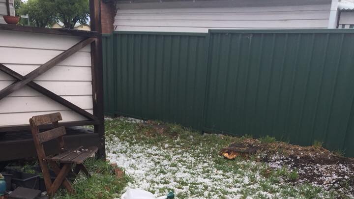 Small pieces of hail in the yard of a property at Kurri Kurri