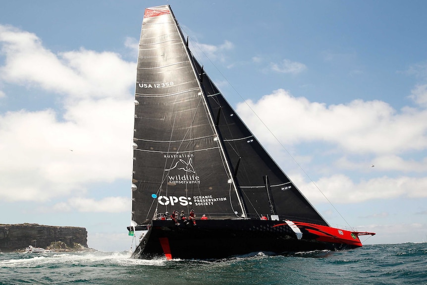 Comanche goes out through Sydney Heads in the 70th Sydney to Hobart