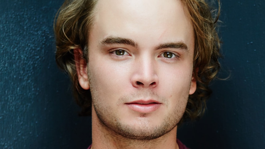 A close-up headshot of actor Callan Purcell