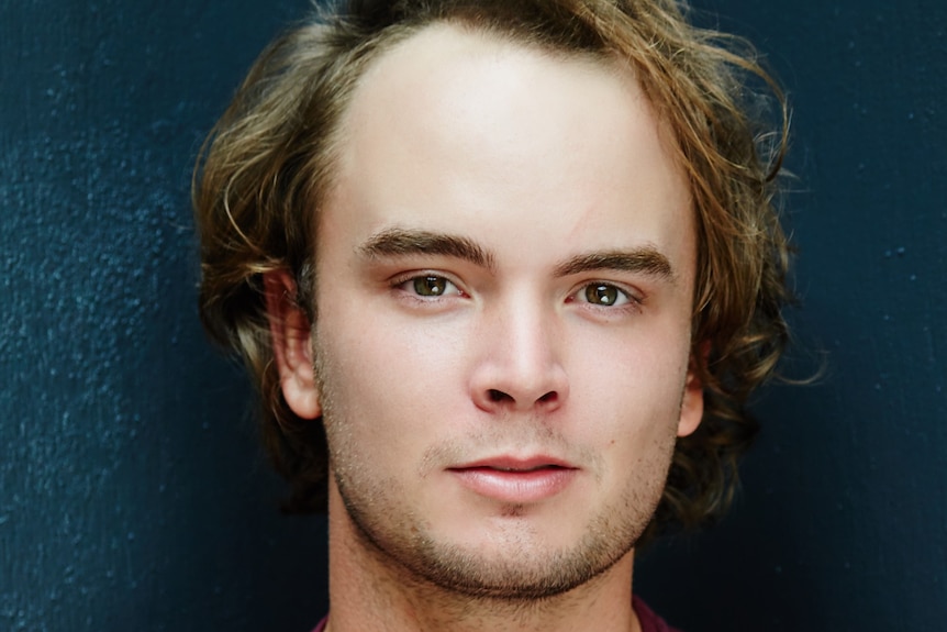 A close-up headshot of actor Callan Purcell