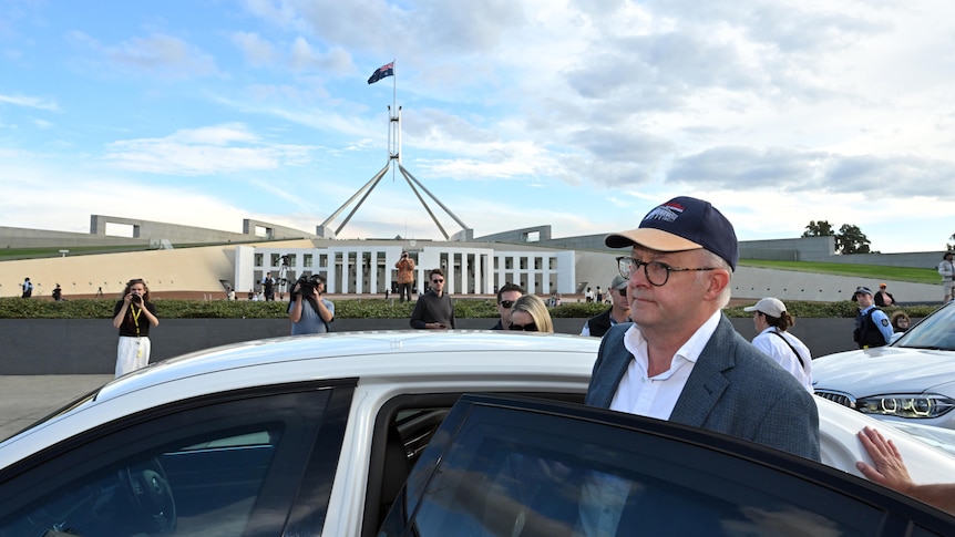 Anthony Albanese gets into the PM's car outside parliament house