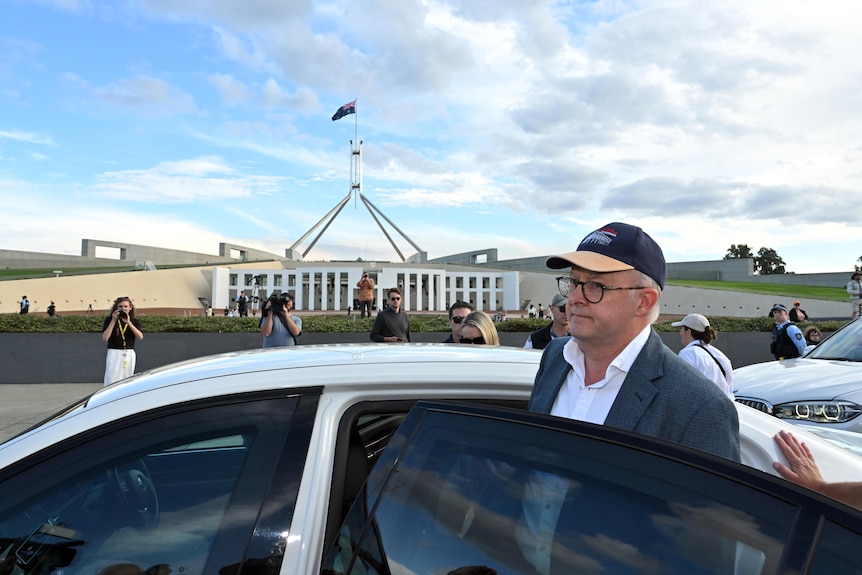 Anthony Albanese gets into the PM's car outside parliament house