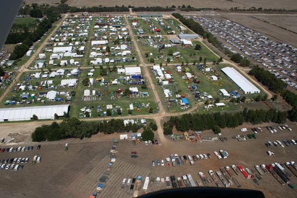 Apicture of a fair in a field from above.