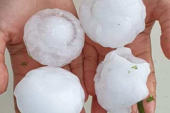 Large hail in a person's hands