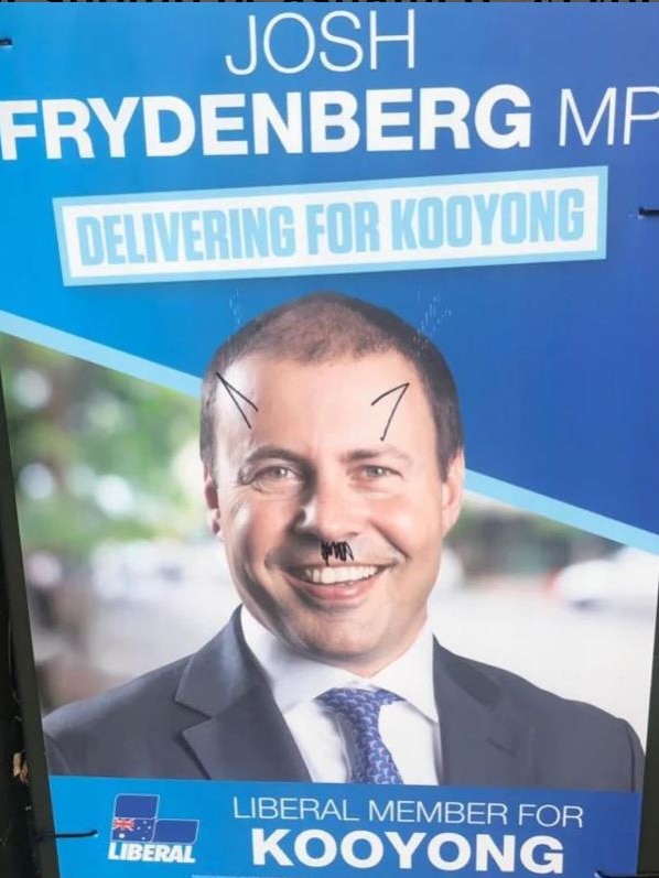 A Hitler moustache and devil horns drawn on Josh Frydenberg's face on his campaign poster