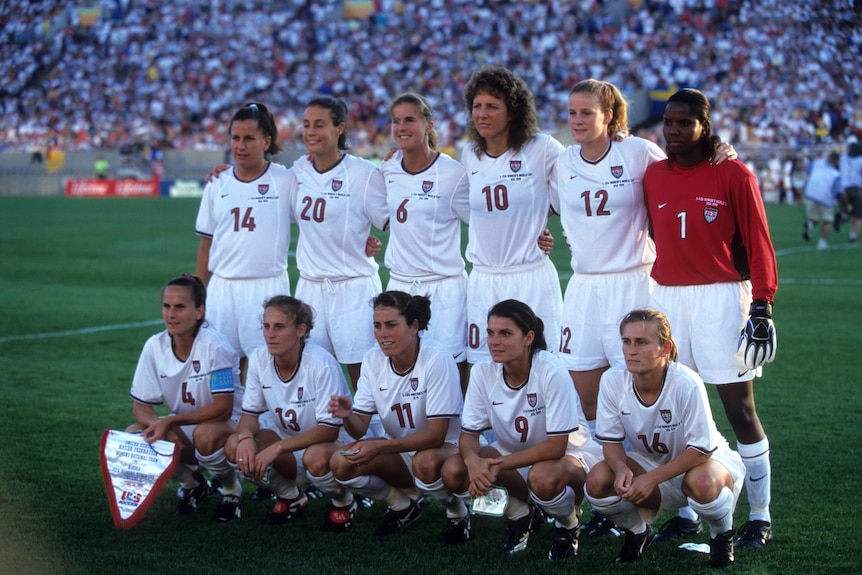 Soccer players line up before a game