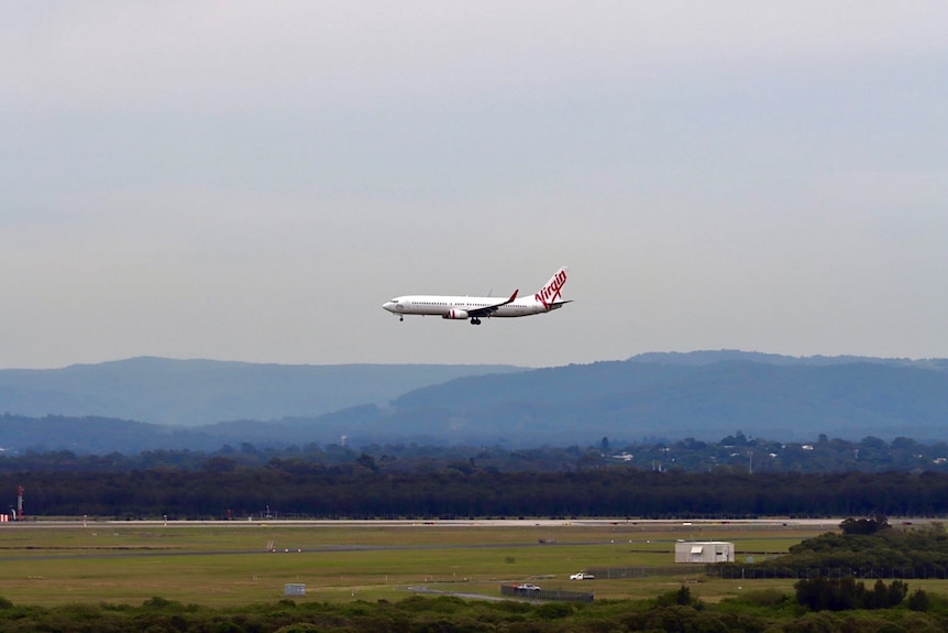 Brisbane airport. Plane coming into landing. Virgin