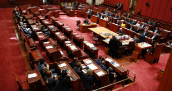 Aerial shot of politicians in the Senate chamber