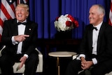 Donald Trump laughs and points towards Malcolm Turnbull during a meeting ahead of Coral Sea 75th anniversary commemorations.
