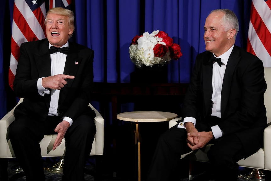 Donald Trump laughs and points towards Malcolm Turnbull during a meeting ahead of Coral Sea 75th anniversary commemorations.