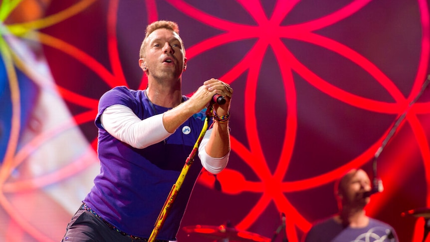 Chris Martin performs on stage.