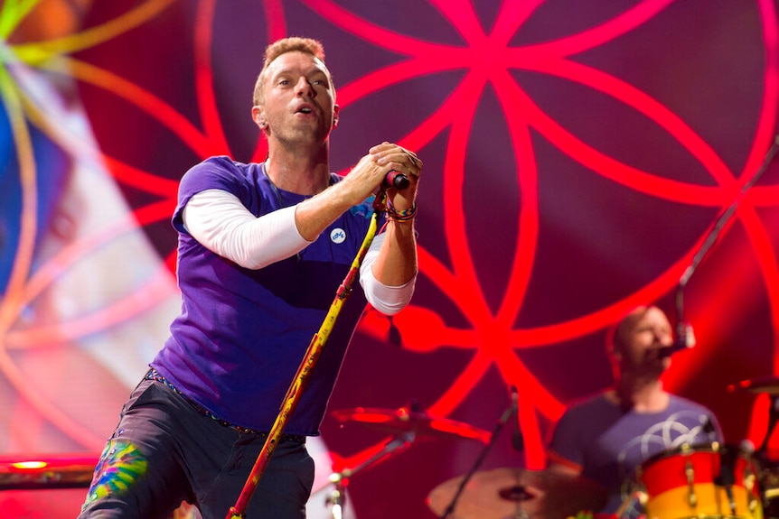 Chris Martin performs on stage.