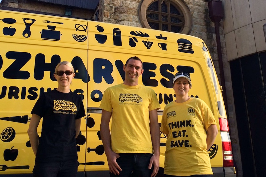 OzHarvest Brisbane state manager Cameron Hickey (centre) hopes to help airlines reduce their food wastage.